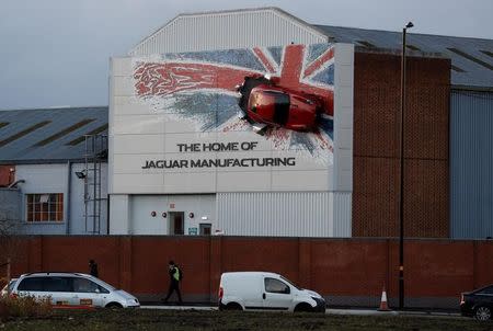 A car hangs on the wall of Jaguar's Castle Bromwich manufacturing facility in Birmingham, Britain, November 17, 2016. REUTERS/Darren Staples