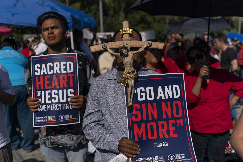 People listen to a message during a prayer service outside Dodger Stadium, Friday, June 16, 2023, in Los Angeles. Devout baseball fans might view their teams' performance as heavenly or hellish, depending on the quality of play. Currently, it is the Los Angeles Dodgers' handling of their annual Pride Night — not the team's record — that has provoked emotional reactions from religious people, including prominent faith leaders, Catholic nuns, and even the team's All-Star ace. (AP Photo/Jae C. Hong)