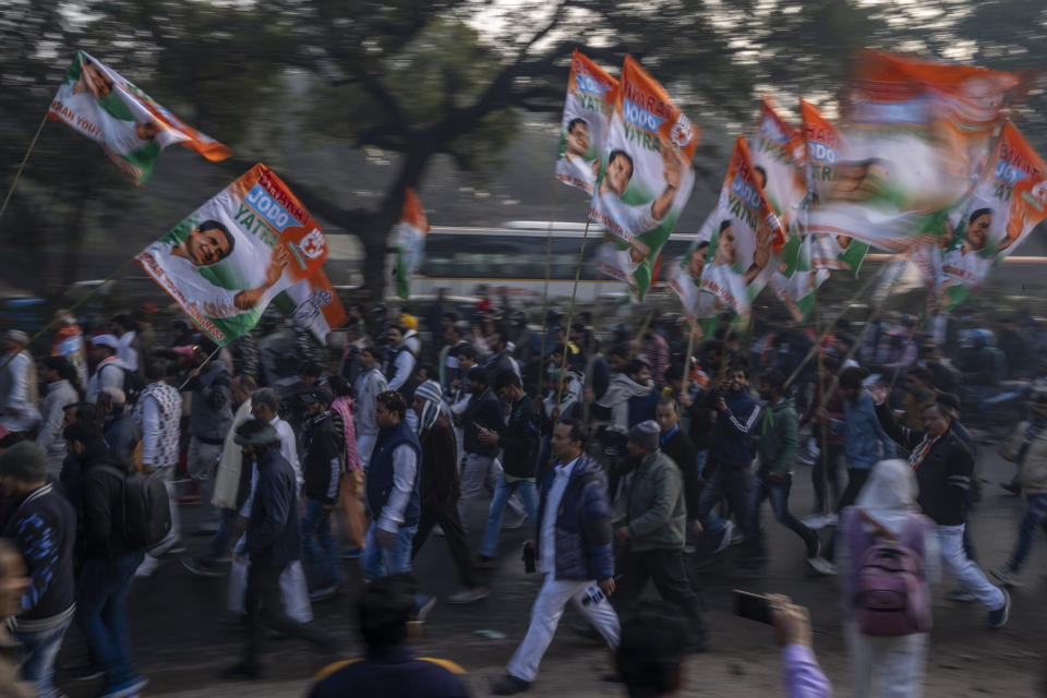 Supporters of Rahul Gandhi march in New Delhi, India, Saturday, Dec. 24, 2022. Rahul Gandhi, leader of India's beleaguered opposition Congress party, on Saturday marched in New Delhi along with his supporters, part of his five-month-long 3,570km (2,218-mile) countrywide trek through 12 states that began 105 days ago.(AP Photo/Altaf Qadri)