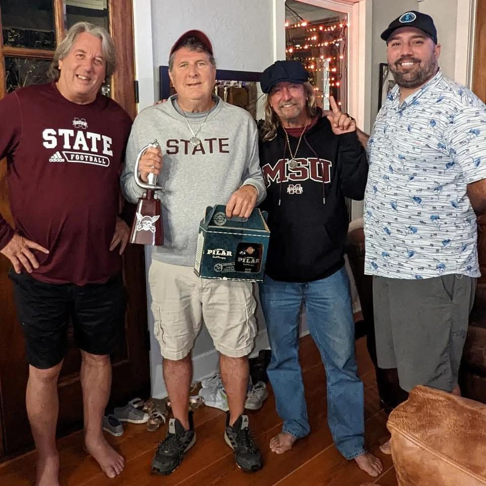 Mike Leach is joined in Starkville by friends from Key West, Florida. From left to right: Joe Clements, Leach, Joe Carter and Andrew Lint.