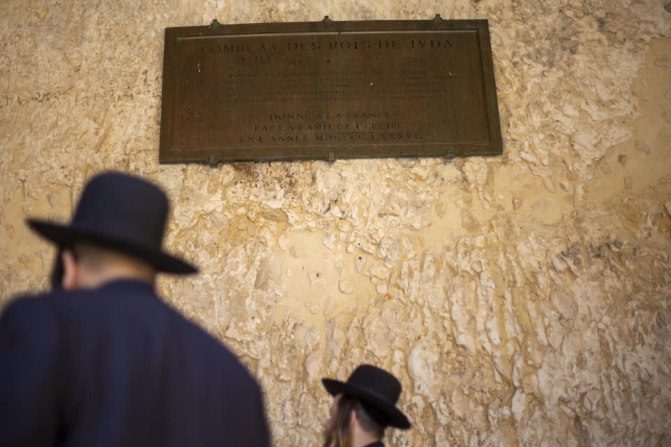 In this Thursday, Oct. 31, 2019 photo, An ultra-Orthodox Jew pray in the Tomb of the Kings, a large underground burial complex dating to the first century BC, in east Jerusalem neighborhood of Sheikh Jarrah. After several aborted attempts, the French Consulate General has reopened one of Jerusalem's most magnificent ancient tombs to the public for the first time in over a decade, sparking a distinctly Jerusalem conflict over access to an archaeological-cum-holy site in the volatile city's eastern half. (AP Photo/Ariel Schalit)