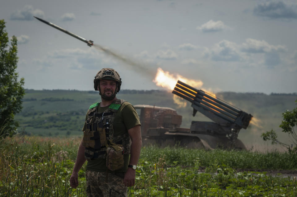 A Ukrainian MSLR BM-21 "Grad" fires towards Russian positions, near Bakhmut at the frontline in Donetsk region, Ukraine, Wednesday, June 21, 2023. (Iryna Rybakova via AP)