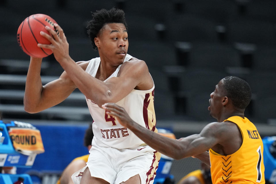 Scottie Barnes is pressured by Isaiah Miller of UNC-Greensboro.