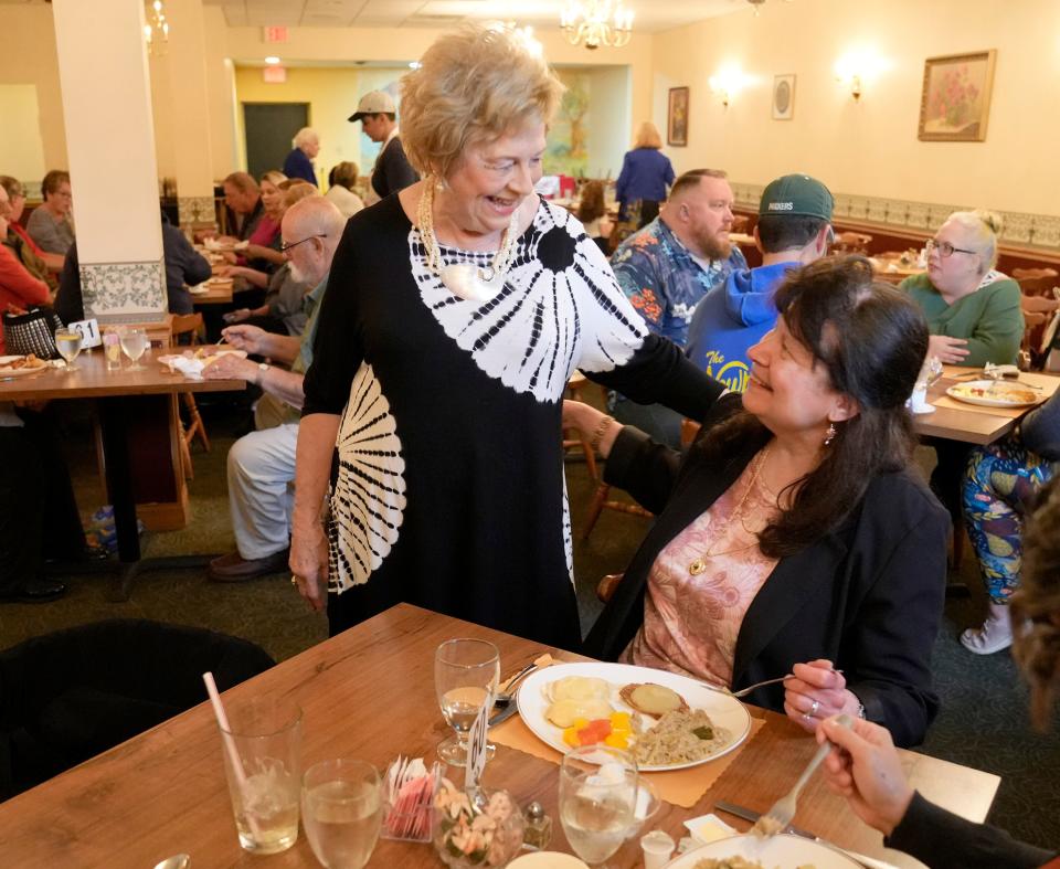 Aleksandra Burzynski talks with customer Kris Wanta of Grafton during brunch at Polonez Restaurant in St. Francis. "I like people. I like greeting people," said the bubbly Polonez co-owner.
