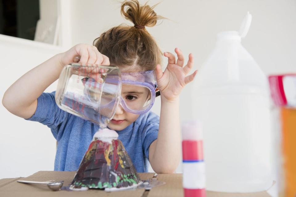 girl making volcano fun activities for kids