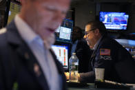 Traders work on the floor at the New York Stock Exchange in New York, Monday, Nov. 28, 2022. (AP Photo/Seth Wenig)