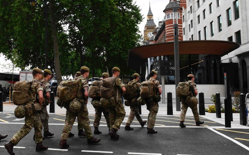 Troops enter New Scotland Yard HQ - Credit: JUSTIN TALLIS/AFP