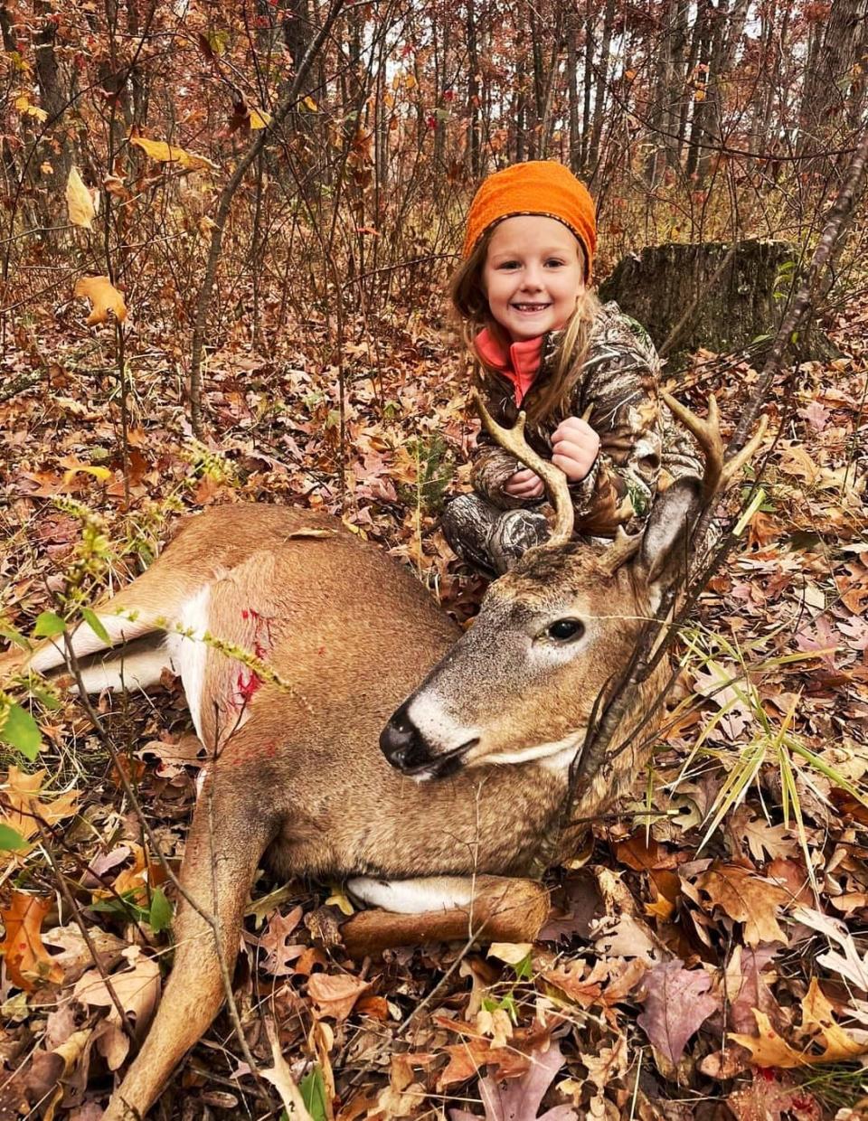 Chandler Nichols poses with a deer.