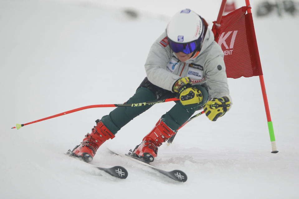 Kiana Kryeziu speeds down the course during training at the Arxhena Ski center in Dragas, Kosovo on Saturday, Jan. 22, 2022. The 17-year-old Kryeziu is the first female athlete from Kosovo at the Olympic Winter Games after she met the required standards, with the last races held in Italy. (AP Photo/Visar Kryeziu)