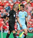 <p>Burnley’s Joey Barton makes a point to the referee</p>