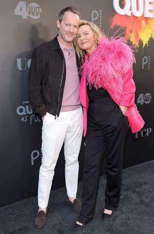 <p>Amy Sussman/Getty </p> Russell Thomas (left) and Kim Cattrall photographed at The Theatre at Ace Hotel on June 03, 2022 in Los Angeles, California.