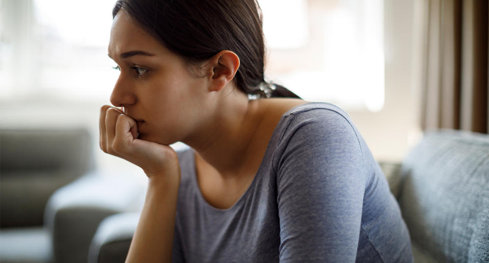 Woman with premenstrual dysphoric disorder symptoms, low mood. (Getty Images)