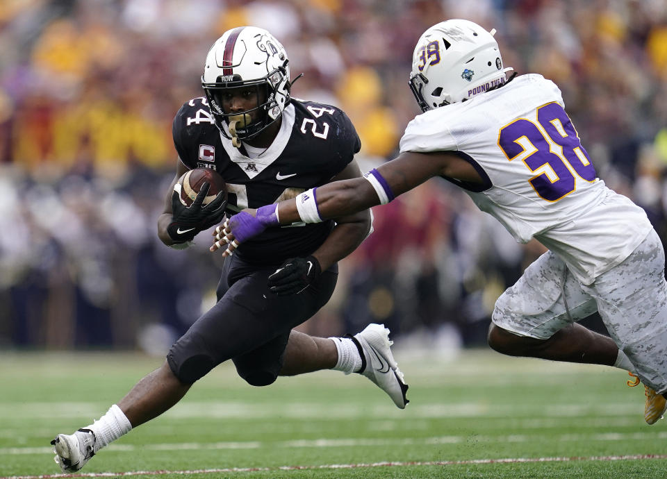 Minnesota running back Mohamed Ibrahim is tackled by Western Illinois defensive back Terry Limehouse Jr during the first half of an NCAA college football game Saturday, Sept. 10, 2022, in Minneapolis. (AP Photo/Abbie Parr)