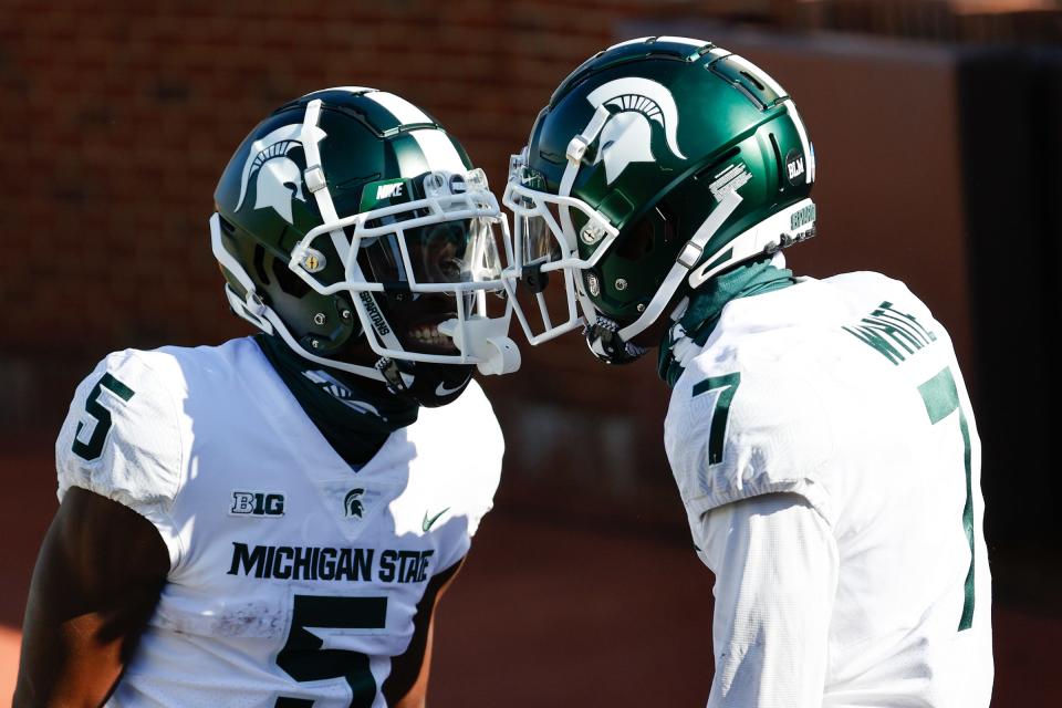 Michigan State Spartans receiver Ricky White (7) receives congratulations from receiver Jayden Reed (5) after scoring in the first half against the Michigan Wolverines at Michigan Stadium, Oct. 31, 2020 in Ann Arbor.