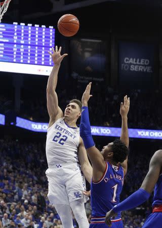 Jan 26, 2019; Lexington, KY, USA; Kentucky Wildcats forward Reid Travis (22) shoots the ball against Kansas Jayhawks forward Dedric Lawson (1) in the second half at Rupp Arena. Mandatory Credit: Mark Zerof-USA TODAY Sports