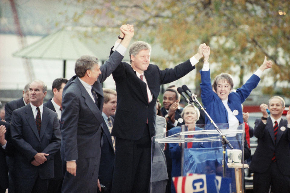 Then presidential candidate Bill Clinton stands at a podium with Murray and Washington gubernatorial candidate Mike Lowry at a rally in 1992.