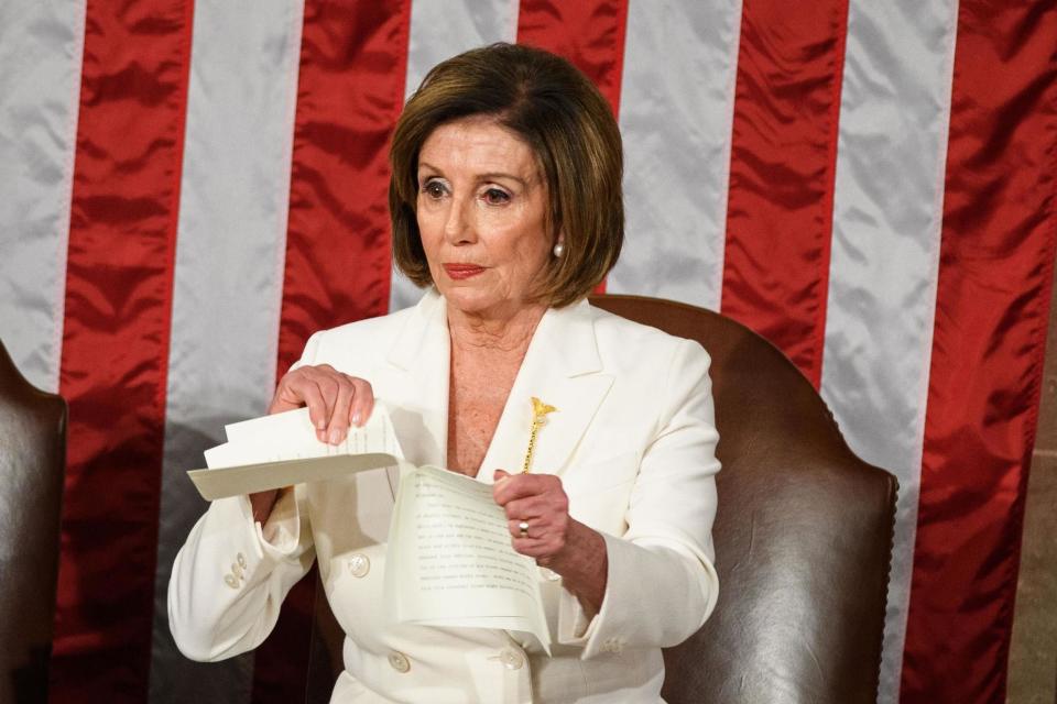 Speaker of the US House of Representatives Nancy Pelosi rips a copy of President Donald Trump's speech after he delivers the State of the Union address at the US Capitol in Washington, DC, on 4 February 2020: MANDEL NGAN/AFP via Getty Images