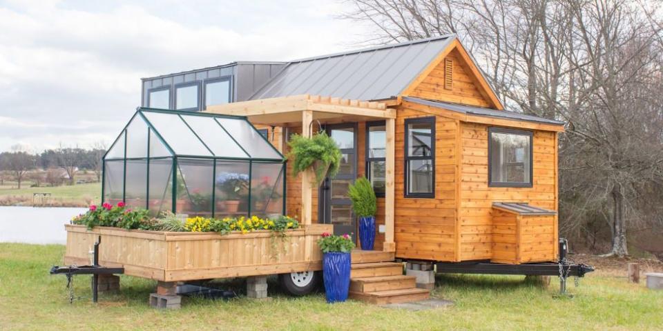 <p> With an attachable greenhouse and porch, the Elsa by Olive Nest Tiny Homes proves that you can still have it all in a small space.</p><p><a class="link " href="https://tinyhouselistings.com/listings/taylors-sc-12-the-elsa/" rel="nofollow noopener" target="_blank" data-ylk="slk:SHOP NOW;elm:context_link;itc:0;sec:content-canvas">SHOP NOW</a> <a class="link " href="https://www.countryliving.com/home-design/house-tours/news/a45229/greenhouse-tiny-home/" rel="nofollow noopener" target="_blank" data-ylk="slk:SEE INSIDE;elm:context_link;itc:0;sec:content-canvas">SEE INSIDE</a> </p>