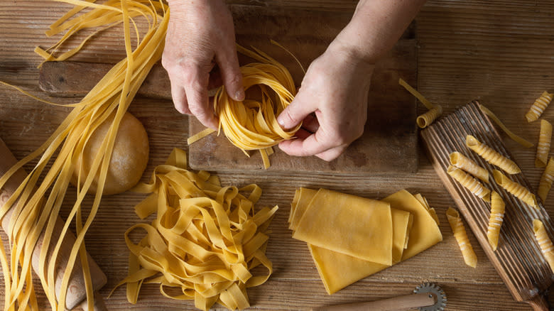 a person making egg noodles