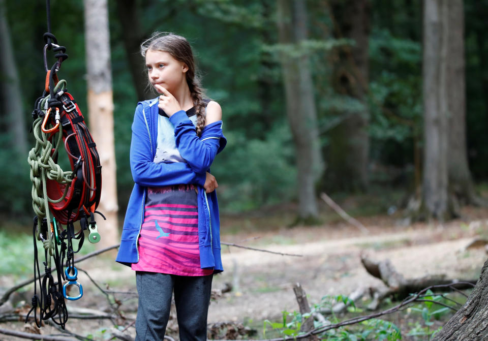 Greta Thunberg, Swedish "Fridays for Future" climate activist, stands next to climbing equipment that hangs from an illegal tree house in the Hambach Forest that is supposed to be chopped away for the nearby open-cast brown coal mine of German utility RWE, west of Cologne, Germany, August 10, 2019. REUTERS/Wolfgang Rattay