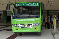 A passenger bus previously run on diesel and converted to electric is seen parked at a depot in Kathmandu, Nepal, Tuesday, April 9, 2024. Nearly all of the electricity produced in Nepal is clean energy, most of it generated by river-fed hydro-electricity. (AP Photo/Niranjan Shrestha)