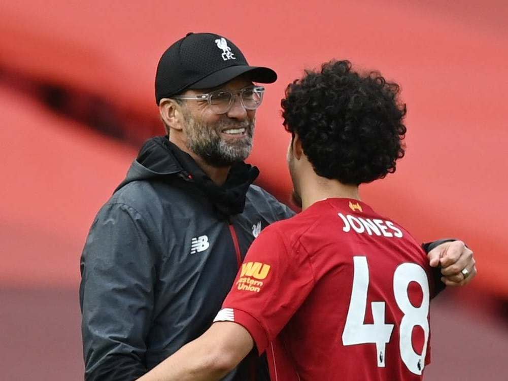 Curtis Jones celebrates with manager Jurgen Klopp: Reuters