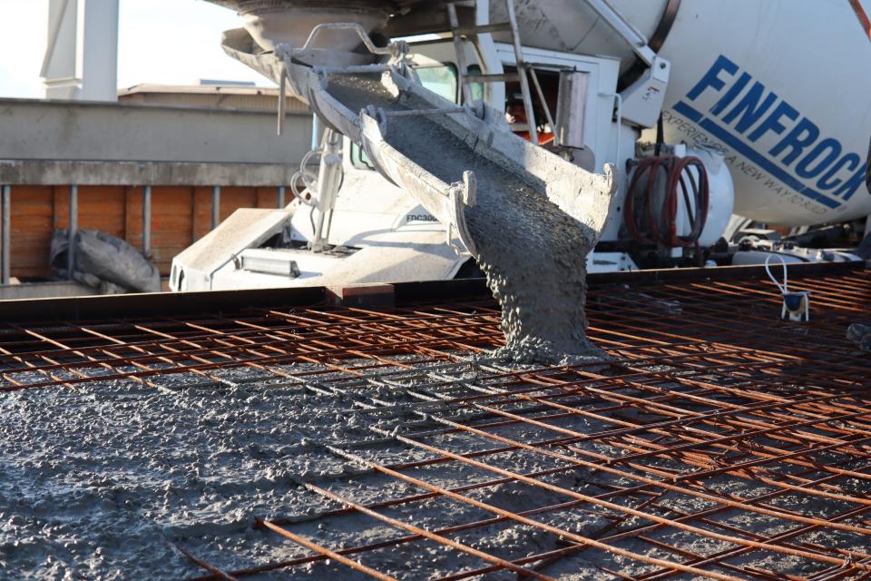 A mixer truck at Finfrock's plant in Belle Glade pours cement for part of a parking garage for the Boca Raton Innovation Campus technology park. The plant is expected to bring 250 jobs to the western Palm Beach County city over the next decade.