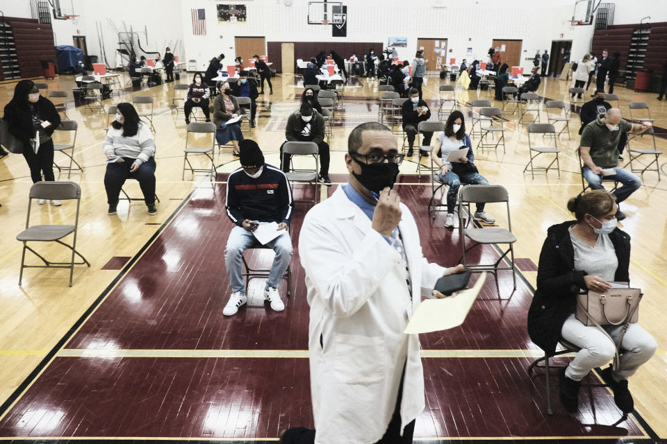 Medical staff watch and advise walk-in patients who received their COVID-19 vaccination at a pop-up clinic at Western International High School on April 12, 2021 in Detroit, Michigan. (Matthew Hatcher/Getty Images)