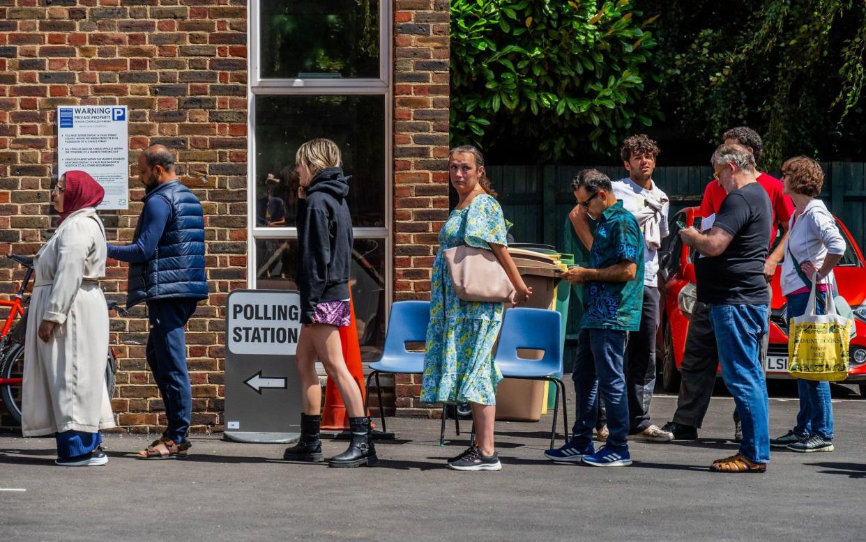 Voters queue at a polling station in the Hampstead and Highgate