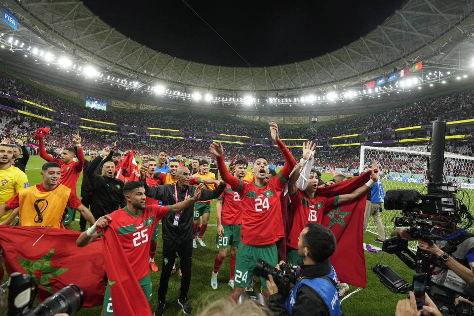 Morocco's players celebrate after the World Cup quarterfinal soccer match between Morocco and Portugal, at Al Thumama Stadium in Doha, Qatar, Saturday, Dec. 10, 2022. (AP Photo/Martin Meissner)