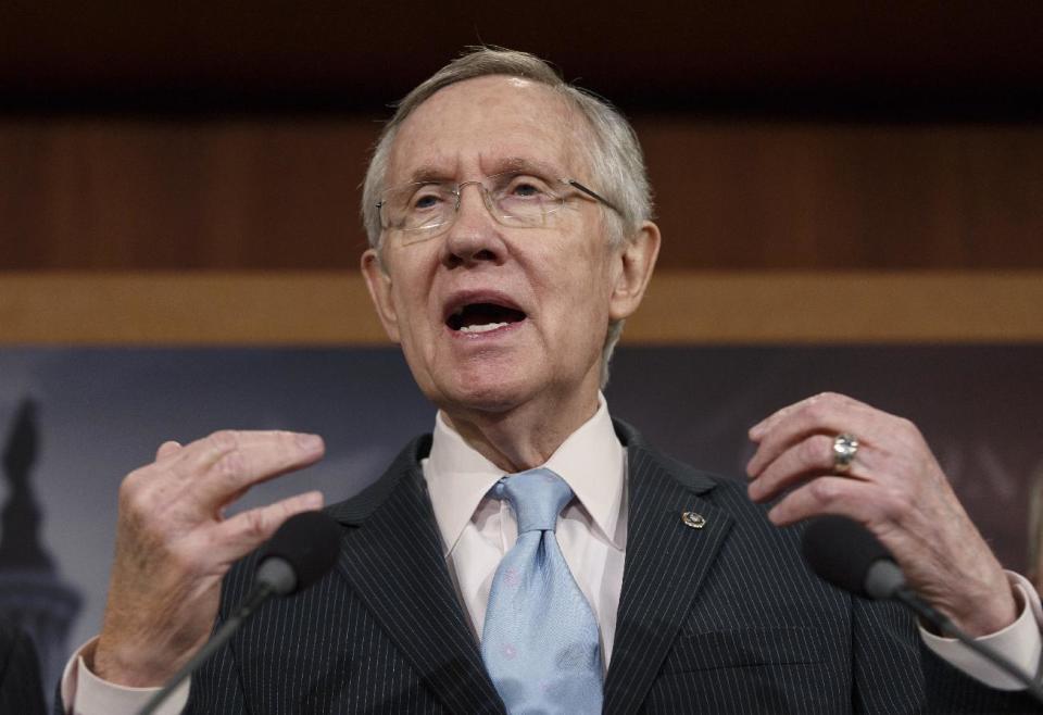 FILE - In this Feb. 6, 2014 file photo0, Senate Majority Leader Harry Reid, D-Nev. speaks on Capitol Hill in Washington. President Barack Obama is working to put two major emerging trade deals with Europe and Asia on a “fast track” to passage. But many congressional Democrats are working to sidetrack the proposed pacts ahead of this year’s U.S. midterm elections. The Democratic president finds himself in the rare position of having House Speaker John Boehner as an ally on the issue and Senate Majority Leader Harry Reid as a foe. (AP Photo/J. Scott Applewhite, File)