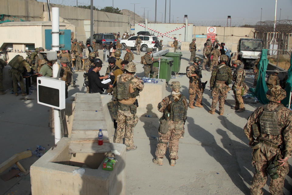 KABUL, AFGHANISTAN - AUGUST 21: In this handout image provided by the Ministry of Defence, the British armed forces work with the U.S. military to evacuate 
eligible civilians and their families out of the country on August 21, 2021 in Kabul, Afghanistan. British armed forces have been evacuation UK citizens and eligible personnel out of the Afghan capital after the Taliban took control of the country last week. (Photo by MoD Crown Copyright via Getty Images)