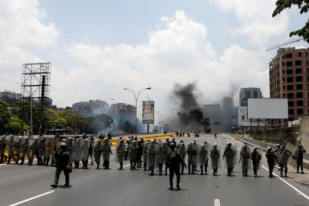 Riot police take position during a rally against Venezuela's President Nicolas Maduro's government in Caracas, Venezuela April 10, 2017. REUTERS/Carlos Garcia Rawlins