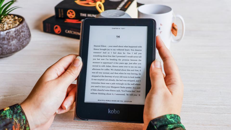 The Kobo Clara 2E ereader being held.