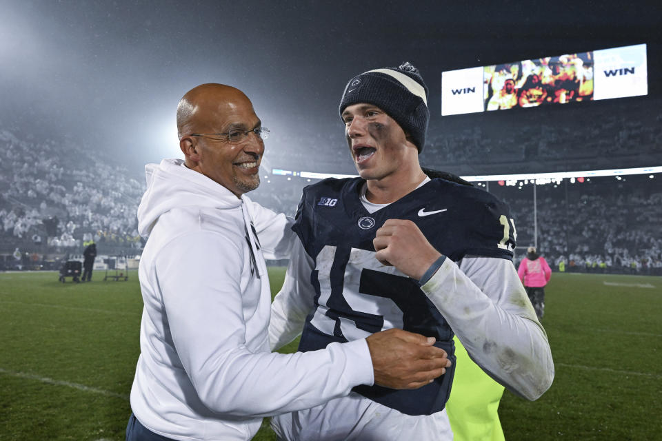 Penn State head coach James Franklin and quarterback Drew Allar (15) celebrate a 31-0 win over Iowa in a NCAA college football game, Saturday, Sept. 23, 2023, in State College, Pa. (AP Photo/Barry Reeger)