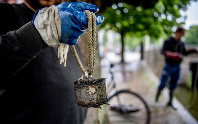 Don't use magnets to seek treasure, experts warn after technique damages  Viking sword found in river