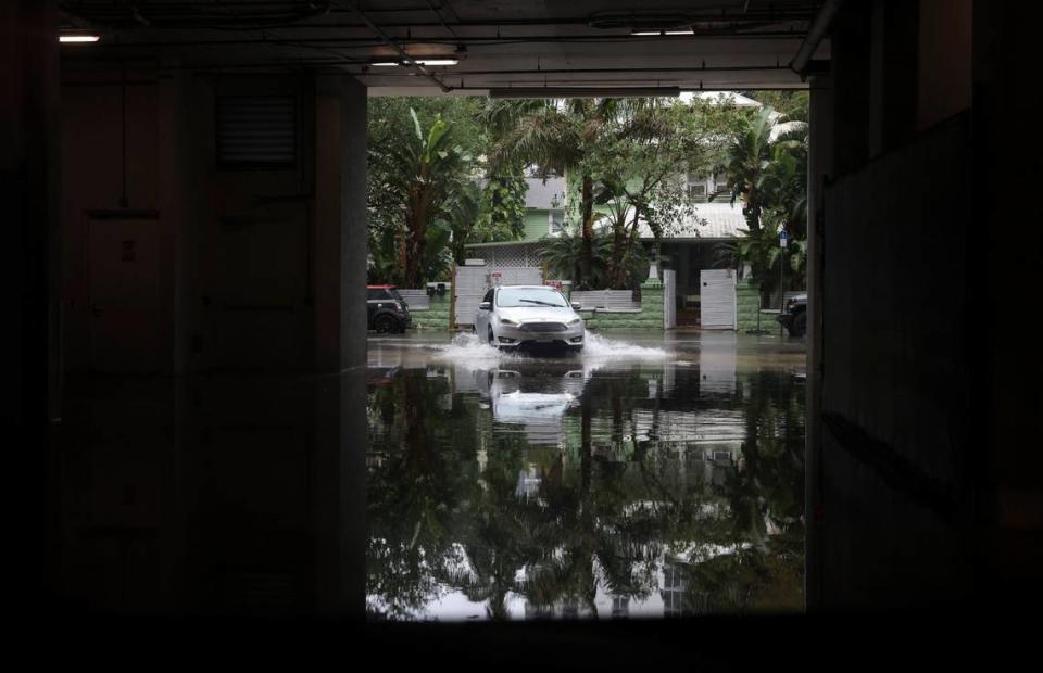 A car pulls into a parking garage on 25th Street during a rainstorm on Wednesday, April 12, 2023, in Edgewater, Miami.