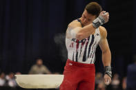 Brody Malone blows chalk off his arm during the men's U.S. Olympic Gymnastics Trials Saturday, June 26, 2021, in St. Louis. (AP Photo/Jeff Roberson)