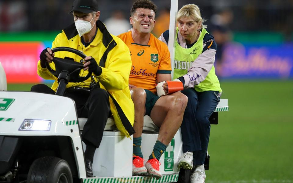 Australia's Tom Banks leaves the field  - AP