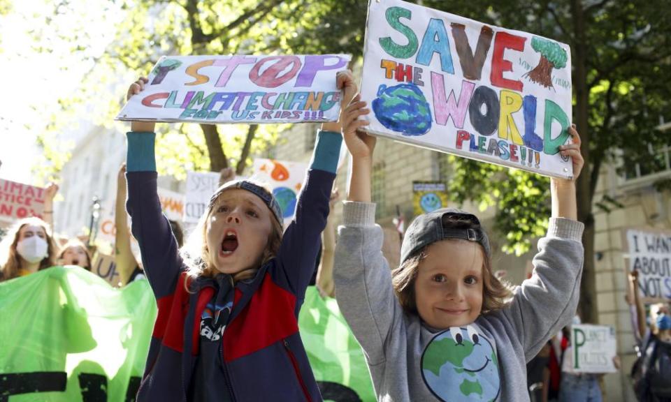 Children holding climate banners