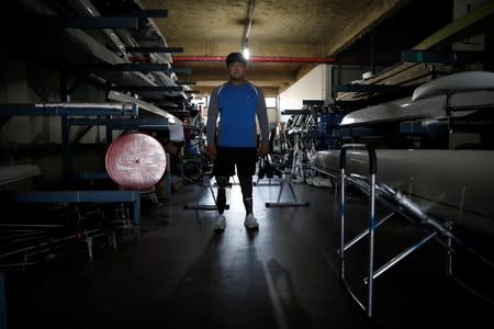 Former South Korean Army sergeant Ha Jae-hun, who lost both his legs in 2015 when he stepped on a North Korean landmine in the DMZ, poses for photographs before a practice session at Misari Rowing Stadium in Hanam, South Korea