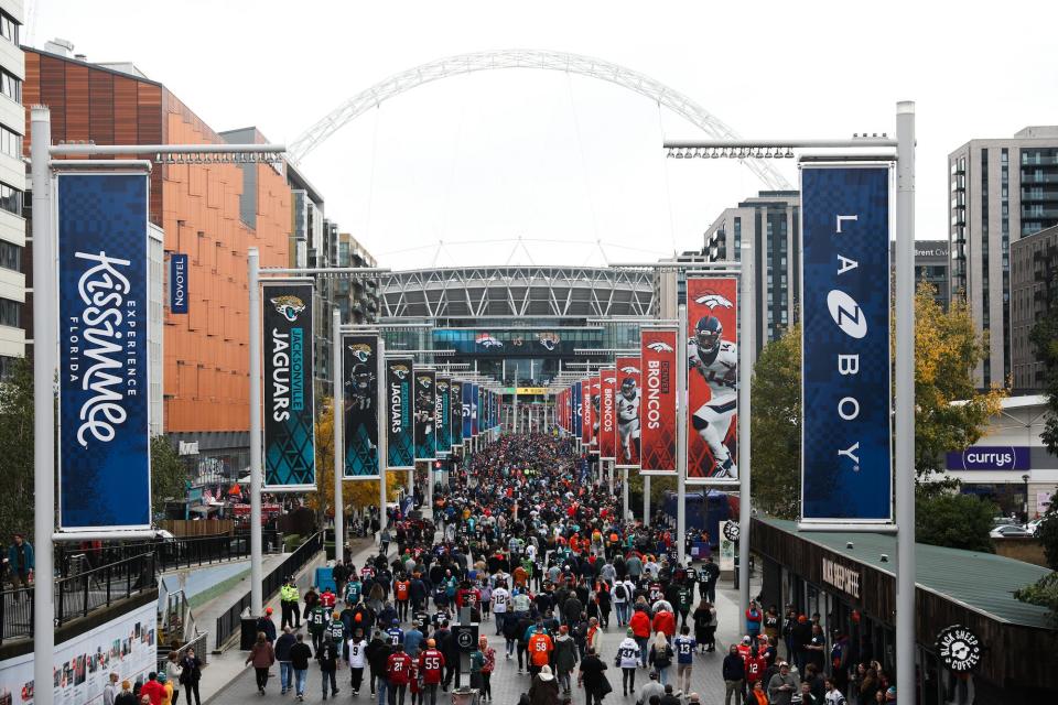 Fans walk down Wembley way ahead of the NFL International match at Wembley Stadium.