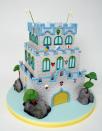 Charm City Cakes' realistic castle cake has three floors.