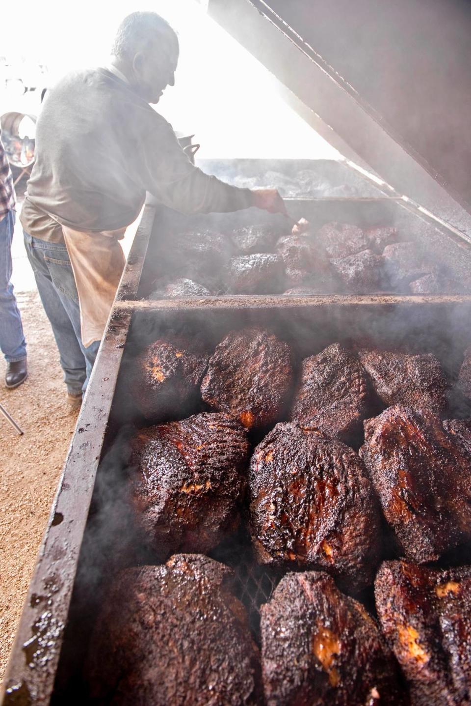 Briskets on the open mesquite pit at Perini Ranch Steakhouse. Handout photo
