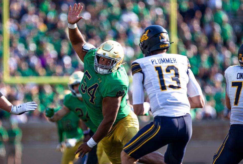 Notre Dame defensive lineman Jacob Lacey (54) tries to get to California quarterback Jack Plummer (13) during the Notre Dame vs. California NCAA football game Saturday, Sept. 17, 2022 at Notre Dame Stadium in South Bend.