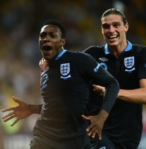 English forward Dany Welbeck (L) celebrates after scoring a goal during their Euro 2012 Group D match against Sweden, on June 15, at the Olympic Stadium in Kiev. England won 3-2