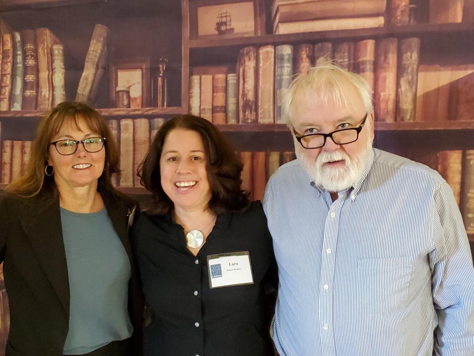Renay Allen, one of the Exeter LitFest coordinators, Lara Bricker, co-organizer and author, and Brendan Dubois, author and a speaker at the event are seen during the festival Saturday, April 2, 2022.