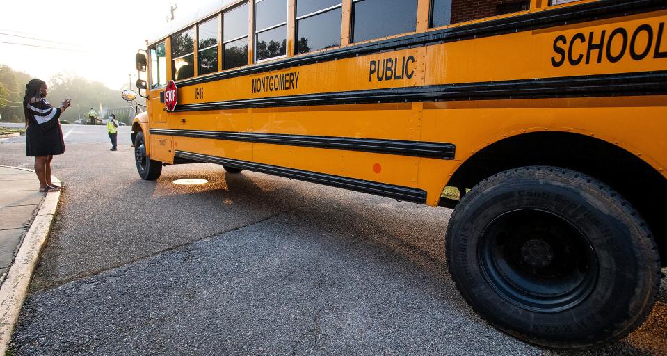 Then-Seth Johnson Elementary School principal Tiffany Scissum greets a school bus as students arrive for the first day of in person classes at the school in Montgomery, Ala., on Tuesday October 13, 2020. She is now the principal at Brewbaker Primary School.