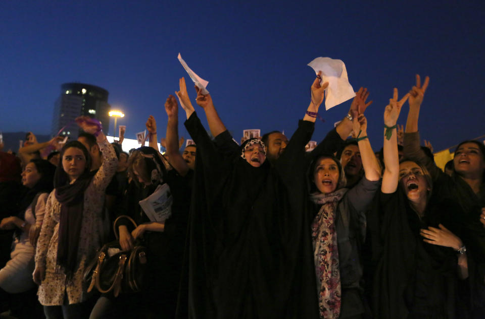 Iranians celebrate the victory of moderate presidential candidate Hassan Rouhani in the Islamic Republic's presidential elections at Vanak square in northern Tehran on June 15, 2013. (ATTA KENARE/AFP/Getty Images)