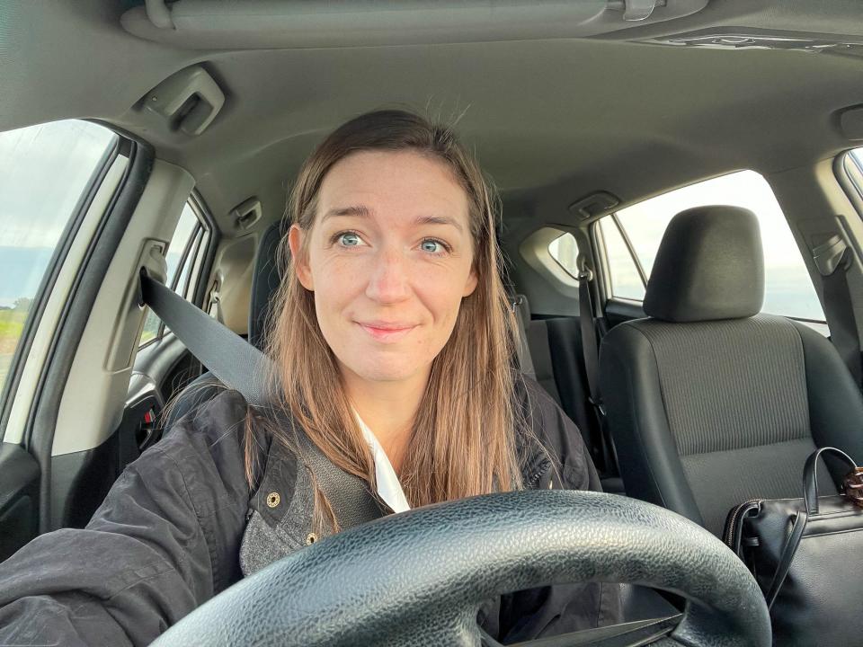 The author in the front seat of a rental car.